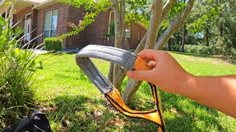 how to pull evergreen bushes out with skid steer|pulling out shrubs from car.